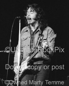 Photo of Rory Gallagher in concert in 1973 by Marty Temme