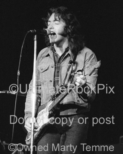 Photo of Rory Gallagher in concert in 1973 by Marty Temme