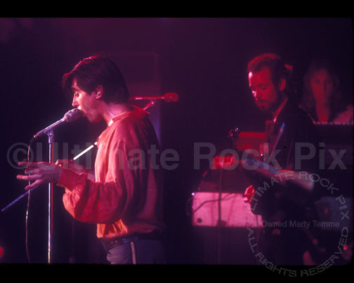 Photo of Bryan Ferry and Phil Manzanera of Roxy Music onstage in 1976 by Marty Temme