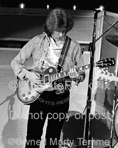 Photo of guitarist Mick Taylor of The Rolling Stones in concert in 1973 by Marty Temme