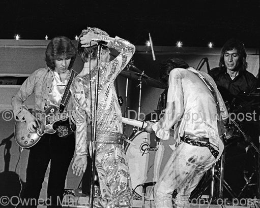 Photo of Mick Taylor, Mick Jagger, Keith Richards and Charlie Watts of The Rolling Stones in 1973 by Marty Temme