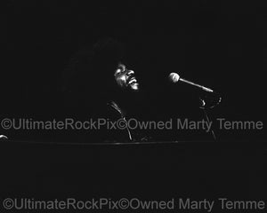 Photo of Billy Preston of The Rolling Stones playing piano in 1975 by Marty Temme