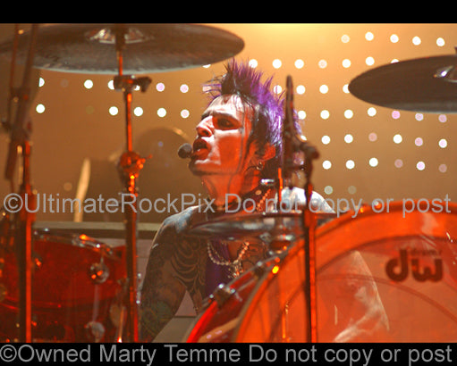 Photo of Tommy Lee of Motley Crue in concert by Marty Temme