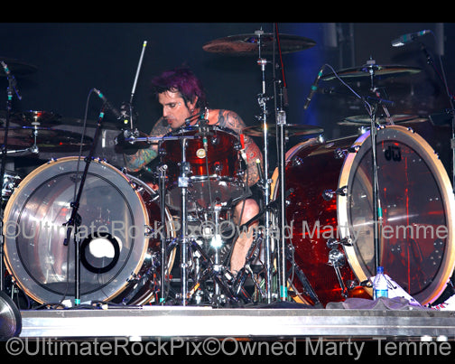 Photo of drummer Tommy Lee of Motley Crue in concert by Marty Temme