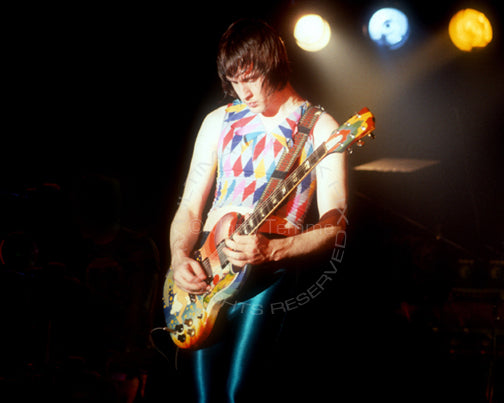 Photo of Todd Rundgren playing The Fool Gibson SG in concert in 1981 by Marty Temme