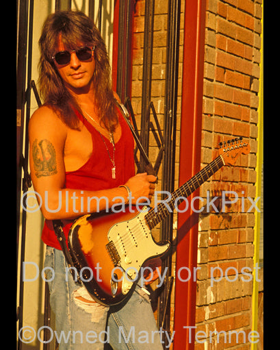 Photo of Richie Sambora with a Fender Stratocaster during a photo shoot in 1991 by Marty Temme