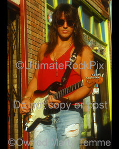Photo of Richie Sambora with a Stratocaster during a photo shoot in 1991 by Marty Temme