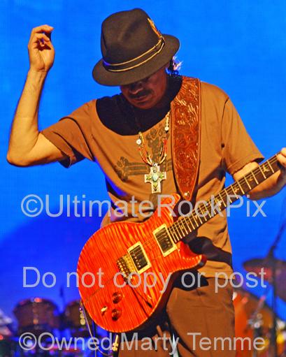Photos of Carlos Santana of Santana Playing a PRS Guitar in Concert by Marty Temme
