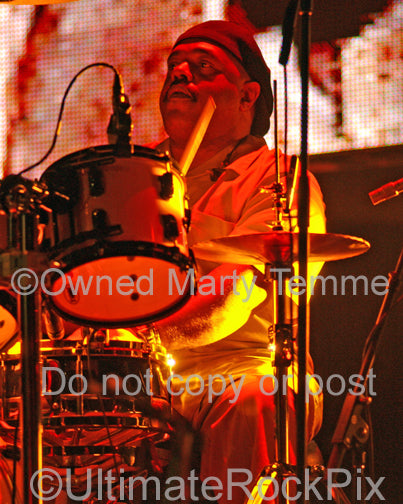 Photo of drummer Dennis Chambers playing in concert by Marty Temme