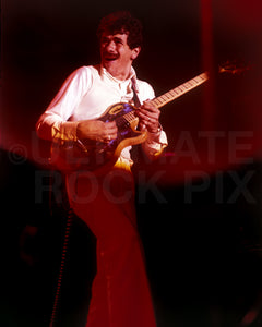 Photo of Carlos Santana of Santana in concert in 1975 by Marty Temme