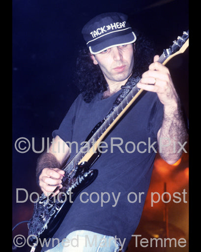 Photo of guitarist Joe Satriani in concert with Spinal Tap in 1992 by Marty Temme