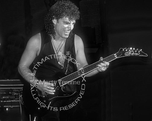 Black and white photo of Neal Schon of Bad English in concert in 1989 by Marty Temme