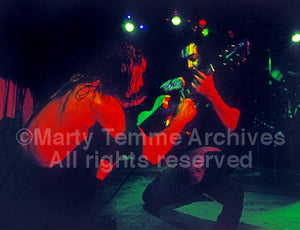 Photo of Chris Cornell and Kim Thayil of Soundgarden performing onstage in 1991 by Marty Temme