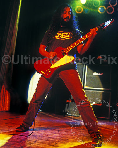 Photo of Kim Thayil of Soundgarden playing a Gibson Firebird in concert in 1991 by Marty Temme