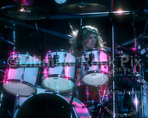 Photo of drummer Greg Ellis of Shark Island in concert in 1988 by Marty Temme