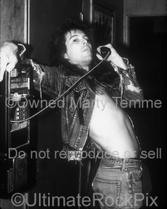 Black and white photo of singer Richard Black of Shark Island backstage in 1988 by Marty Temme