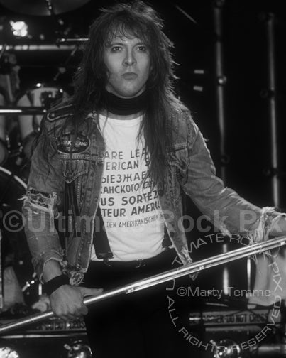 Black and white photo of Richard Black of Shark Island onstage in 1989