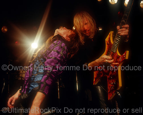 Photo of Richard Black and Spencer Sercombe of Shark Island onstage in 1989 by Marty Temme