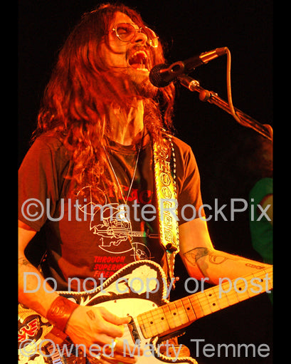 Photo of Shooter Jennings playing his Telecaster in concert by Marty Temme