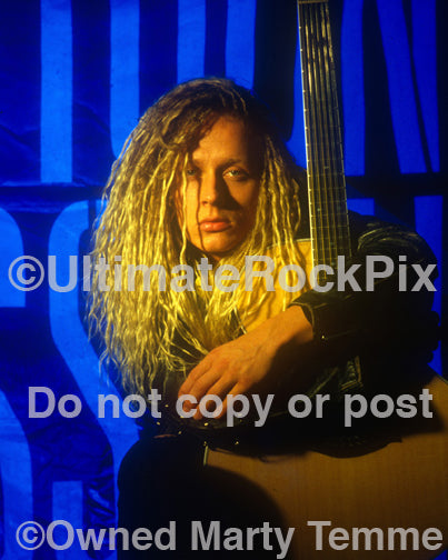 Photo of Tim Skold of Shotgun Messiah holding an acoustic guitar in 1992 by Marty Temme