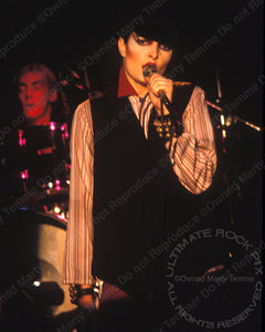 Photo of Siouxsie Sioux performing onstage in 1980 by Marty Temme