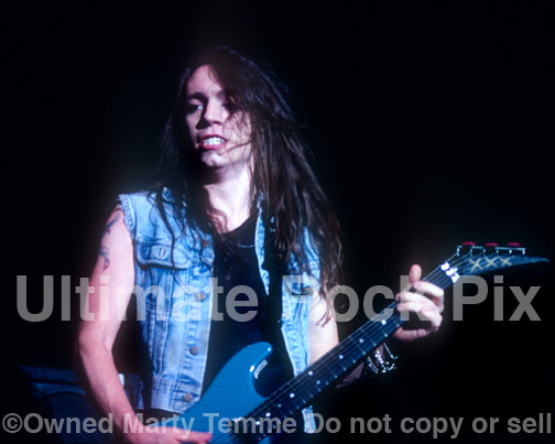 Photo of guitar player Scotti Hill of Skid Row in concert in 1989 by Marty Temme
