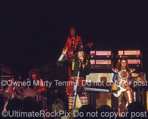 Photo of Don Powell, Dave Hill, Noddy Holder and Jim Lea of Slade in 1973 by Marty Temme