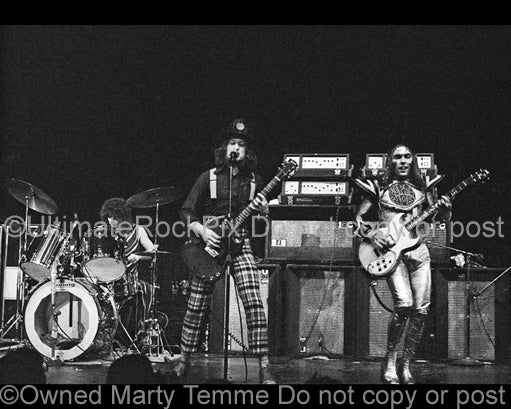 Photo of Don Powell, Noddy Holder and Dave Hill of Slade in concert in 1973 by Marty Temme