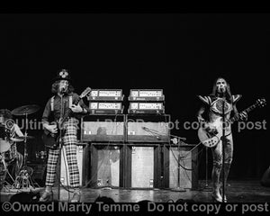 Black and white photo of Noddy Holder and Dave Hill of Slade in concert in 1973 by Marty Temme
