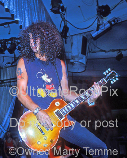 Photo of Slash of Guns N' Roses playing a sunburst Les Paul at The Hollywood Palladium in 1990 in Hollywood, California by Marty Temme