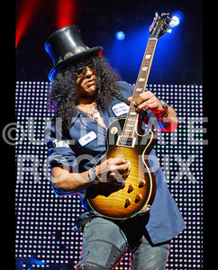 Photo of Slash of Guns N' Roses playing a Les Paul in concert by Marty Temme