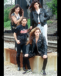 Photo of the rock band Slaughter during a location photo shoot in Detroit, Michigan in 1990 by Marty Temme