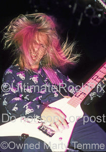 Photo of Dana Strum of Slaughter in concert in 1990 by Marty Temme