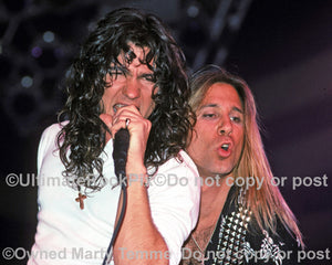 Photo of Mark Slaughter and Dana Strum of Slaughter in concert in 1990 by Marty Temme