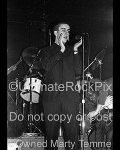Photo of Terry Hall of The Specials in concert in 1980 by Marty Temme