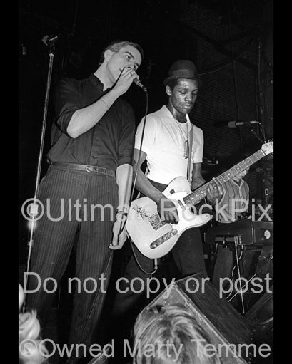 Photo of Terry Hall and Lynval Golding of The Specials in concert in 1980 by Marty Temme