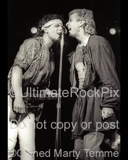 Photo of Randy California and Jay Ferguson of Spirit in concert in 1985 by Marty Temme