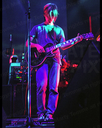 Photo of guitarist James Iha of Smashing Pumpkins in concert in 1994 by Marty Temme