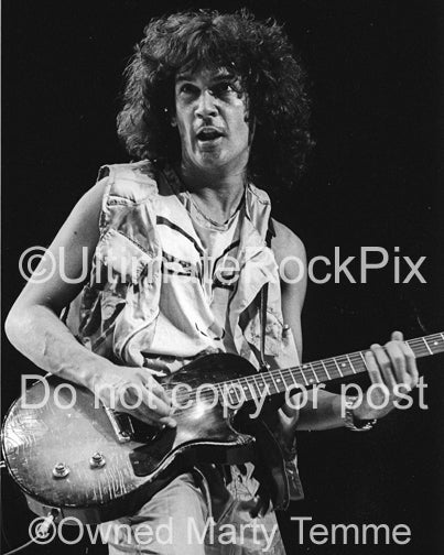 Photo of Billy Squier playing a Les Paul Junior in concert in 1984 by Marty Temme