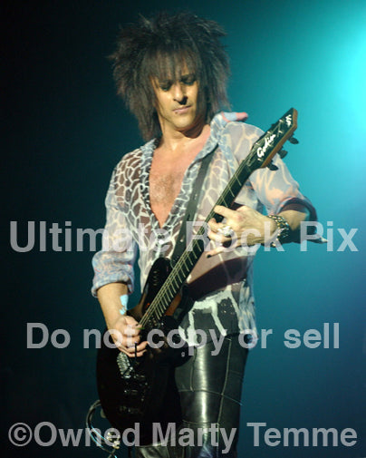 Photo of guitarist Steve Stevens of Billy Idol in concert in 2005 by Marty Temme
