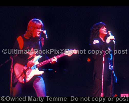 Photo of Paul Kantner and Grace Slick of Jefferson Starship in concert in 1975 by Marty Temme