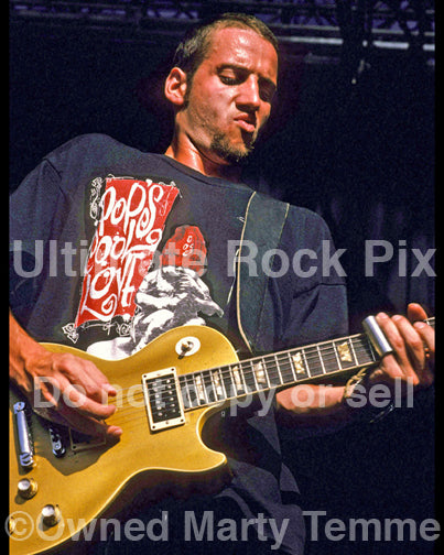 Photo of guitar player Stone Gossard of Pearl Jam performing in 1992 by Marty Temme