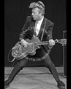 Black and white photo of Brian Setzer of The Stray Cats in concert by Marty Temme
