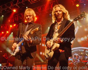 Photo of James "JY" Young and Tommy Shaw of Styx in concert by Marty Temme