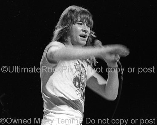 Photo of Brian Connolly of The Sweet performing in concert in 1976 by Marty Temme