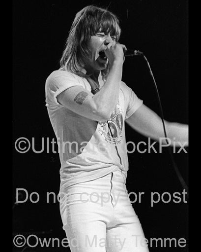 Photo of vocalist Brian Connolly of The Sweet in concert in 1976 by Marty Temme