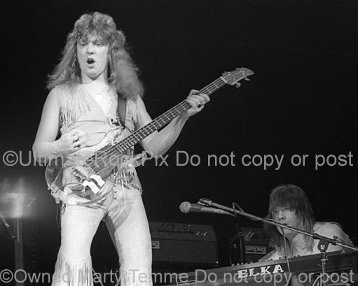 Photo of Steve Priest of The Sweet in concert in 1976 by Marty Temme