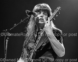 Photo of guitarist Andy Scott of The Sweet onstage in 1976 by Marty Temme