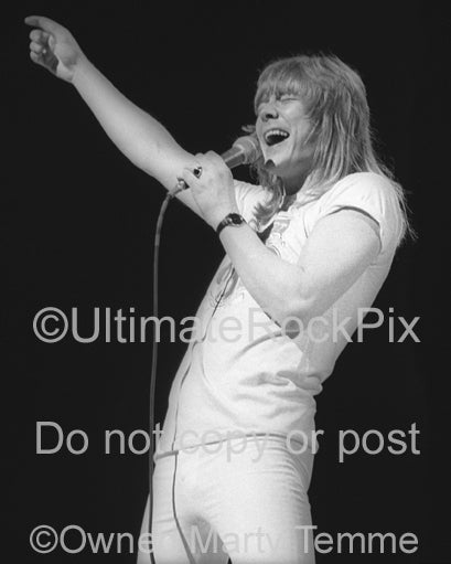 Photo of Brian Connolly of The Sweet in concert in 1976 by Marty Temme
