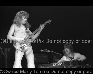 Photo of bassist Steve Priest of The Sweet in concert in 1976 by Marty Temme